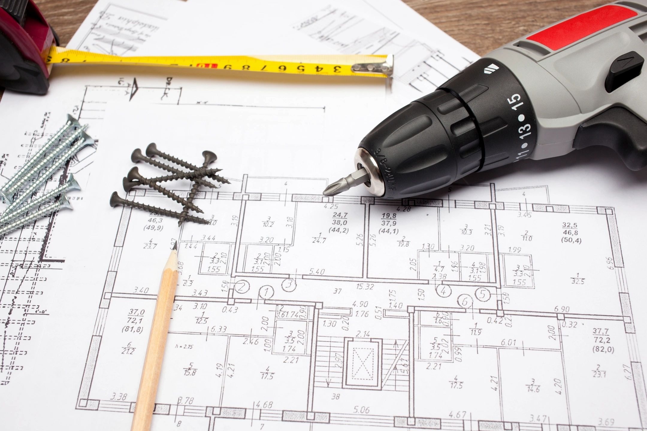 Construction tools on architectural blueprint
